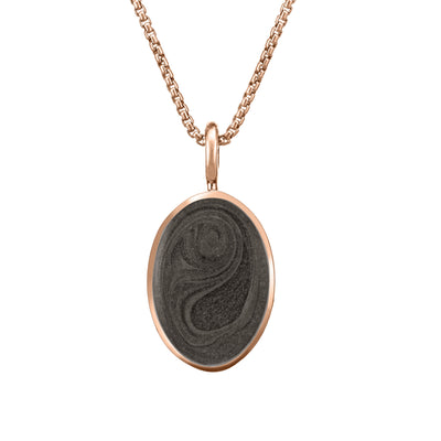 The simple bail oval pendant with ashes by close by me jewelry in 14k rose gold from the front