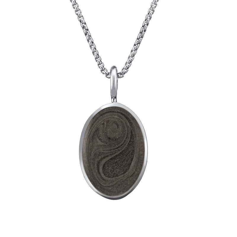 The simple bail oval pendant with cremated remains by close by me jewelry in 14k white gold from the front