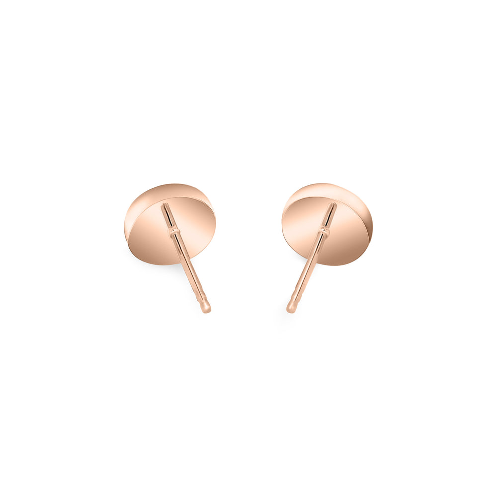 close by me's 14k rose gold circular stud earrings with ashes from the back