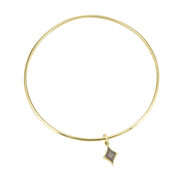 single bangle cremation bracelet in 14k yellow gold with diamond charm shown from the top