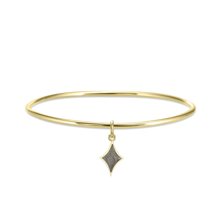 single bangle cremation bracelet in 14k yellow gold with diamond charm shown from the front