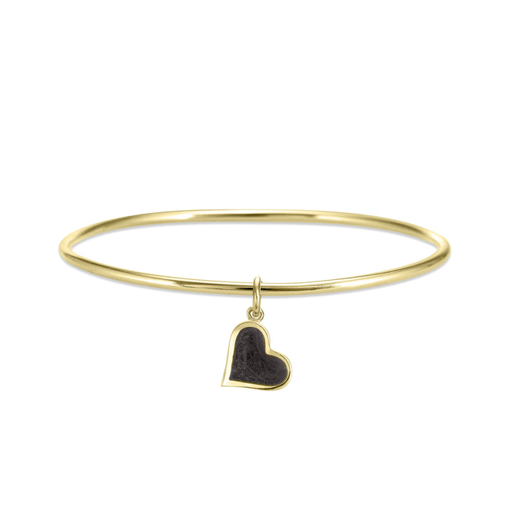 single bangle cremation bracelet in 14k yellow gold with dainty heart charm shown from the front
