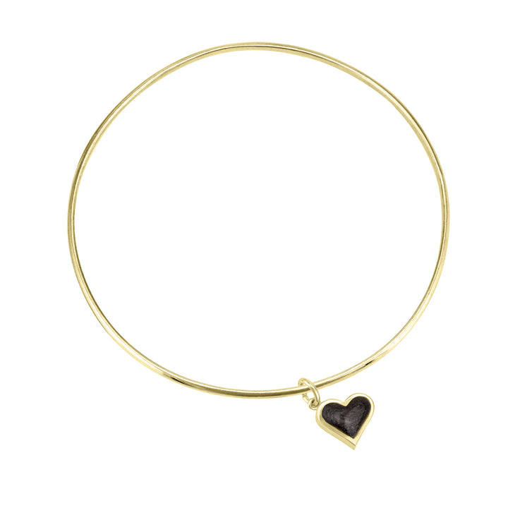 single bangle cremation bracelet in 14k yellow gold with dainty heart charm shown from the top