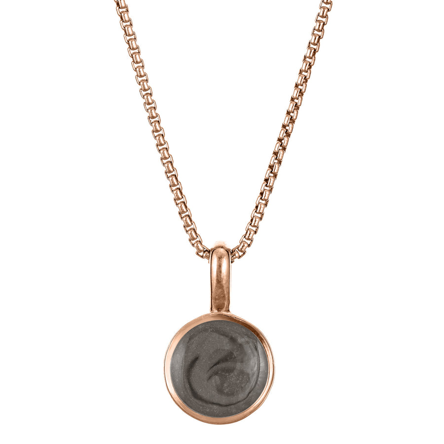 The 14K Rose Gold Single Setting Circle Ashes Pendant designed and set with cremains by close by me jewelry from the front