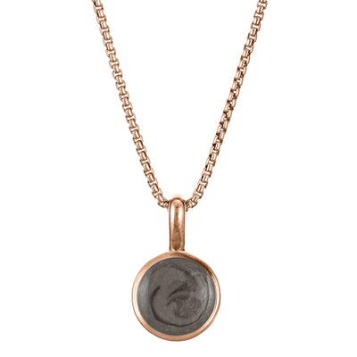 The 14K Rose Gold Single Setting Circle Ashes Pendant designed and set with cremains by close by me jewelry from the front