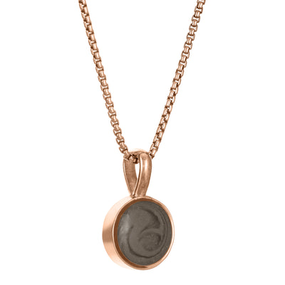 The 14K Rose Gold Single Setting Circle Ashes Pendant designed and set with cremains by close by me jewelry from the side