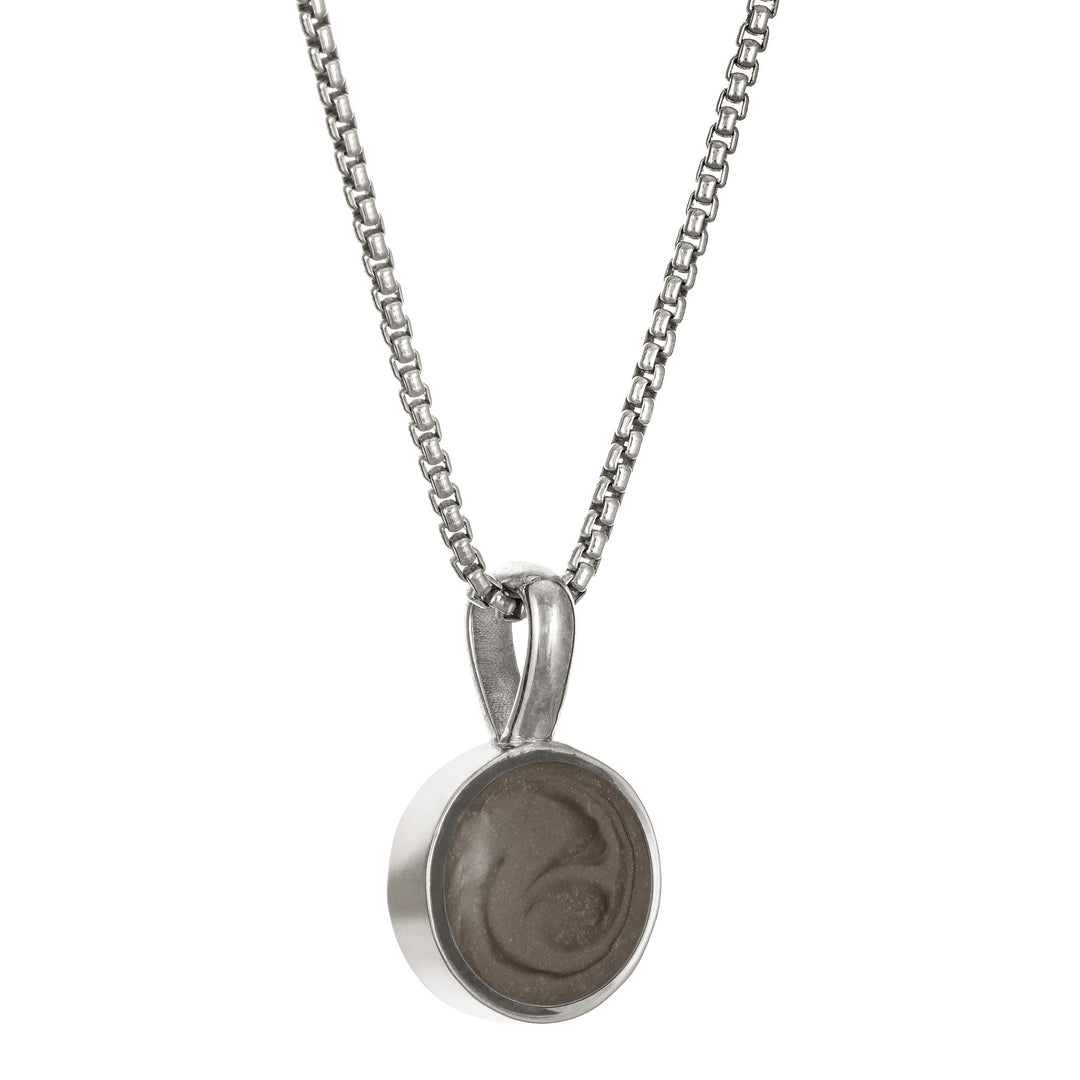 The Sterling Silver Single Setting Circle Ashes Necklace designed and set with cremains by close by me jewelry from the side
