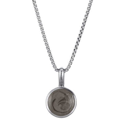 The 14K White Gold Single Setting Circle Cremains Pendant designed and set with cremains by close by me jewelry from the front