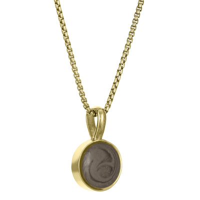 The 14K Yellow Gold Single Setting Circle Ashes Pendant designed and set with cremains by close by me jewelry from the side