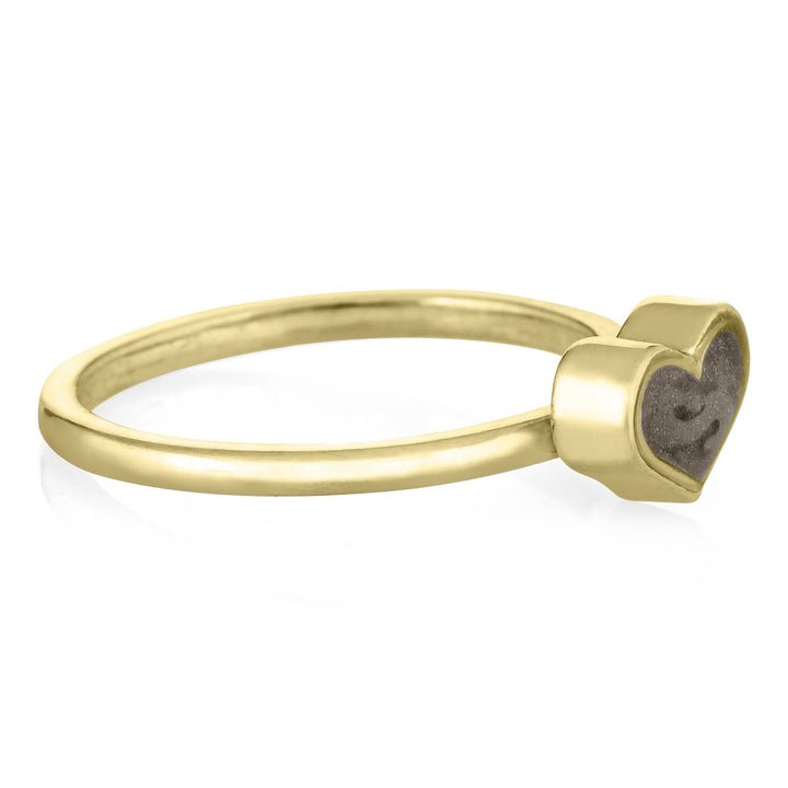 Pictured here is the 14K Yellow Gold Small Heart Stacking Ashes Ring designed by close by me jewelry from the side
