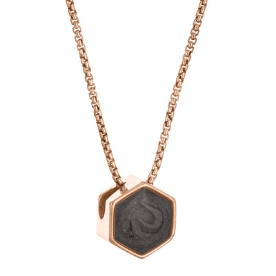 This photo shows the Small Hexagon Sliding Cremation Necklace designed by close by me jewelry in 14K Rose Gold from the side