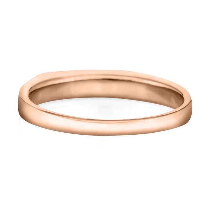 A back view showing the shank of the cremation ring the smooth band ring in 14k rose gold