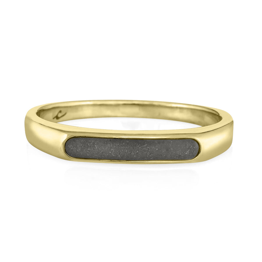 A close up view showing the cremation setting in close by me's 14k yellow gold smooth band ring