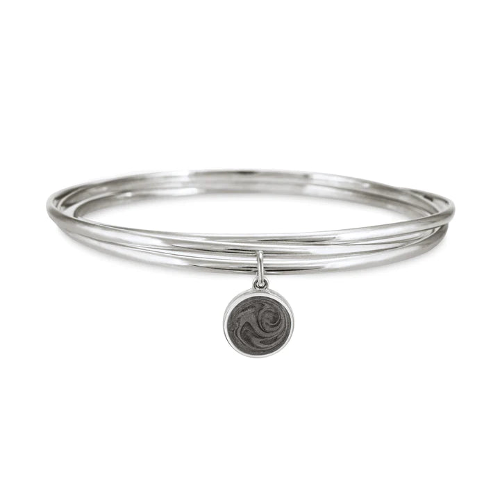 Sterling silver interlocking bangle cremation bracelet with a 10mm ashes dome charm, shown from the front