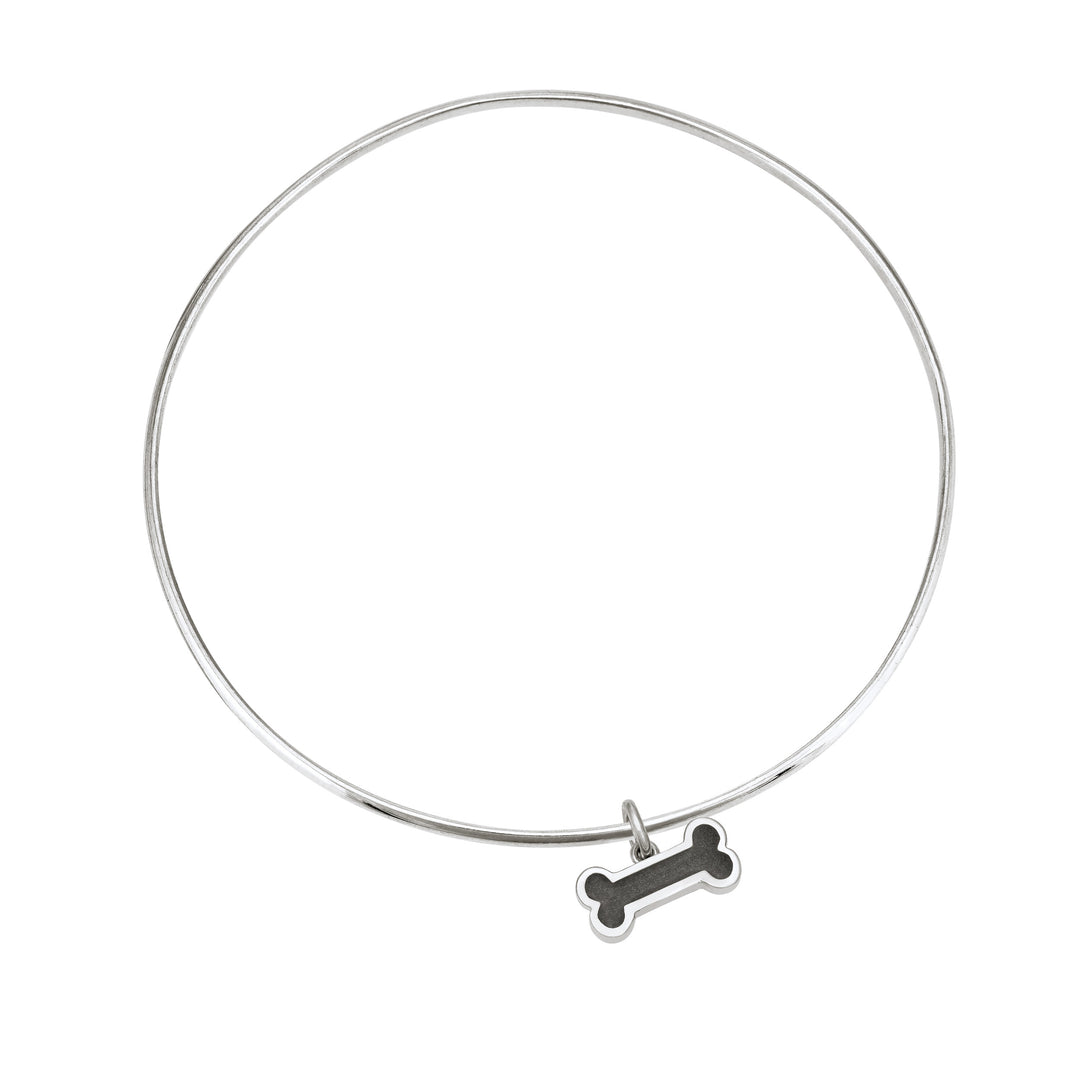 Sterling silver single bangle cremation bracelet with dog bone ashes charm shown from the top