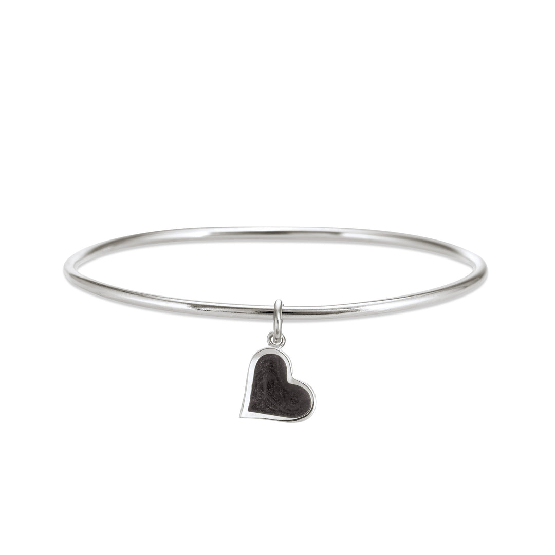 Sterling silver single bangle cremation bracelet with heart ashes charm shown from the front