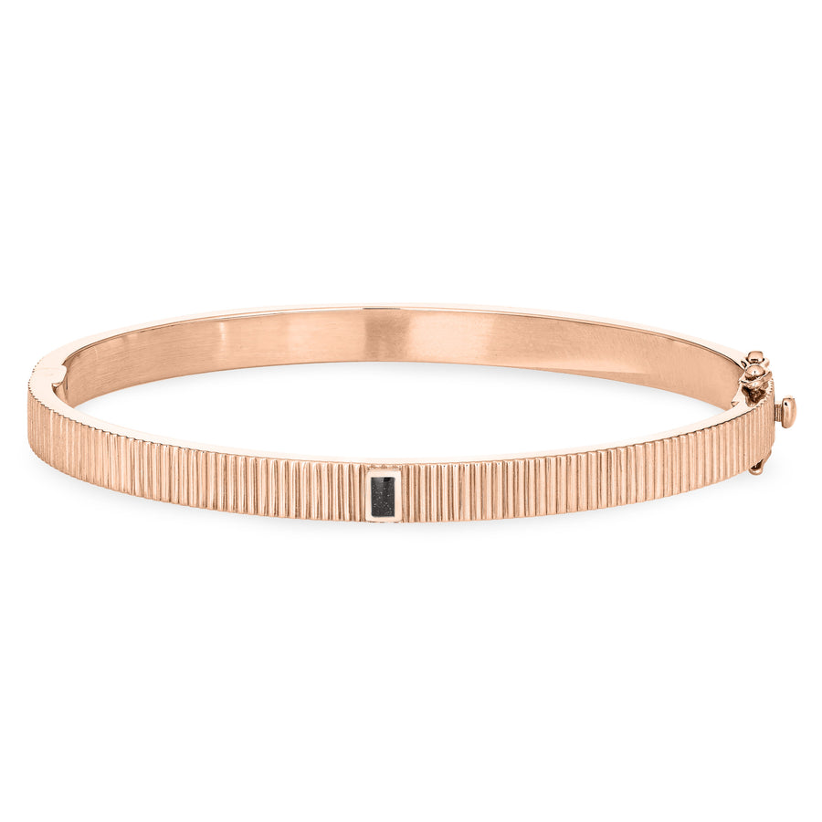 Close By Me's Tessa Bangle Cremation Bracelet in 14K Rose Gold lays flat and facing forward in a closed position against a solid white backdrop.