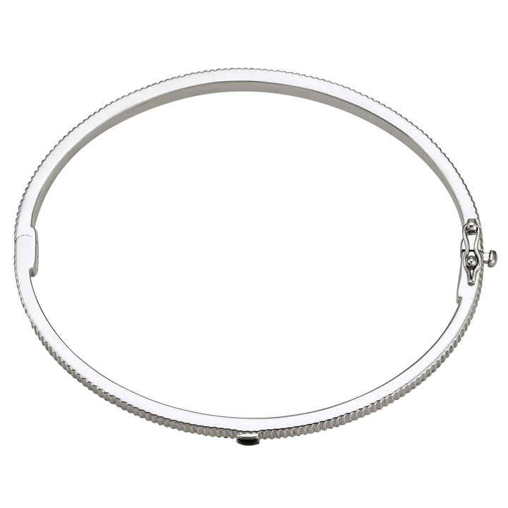 Overhead view of Close By Me's Tessa Bangle Cremation Bracelet in Rhodium Plated Sterling Silver laying flat and in a closed position against a solid white backdrop.