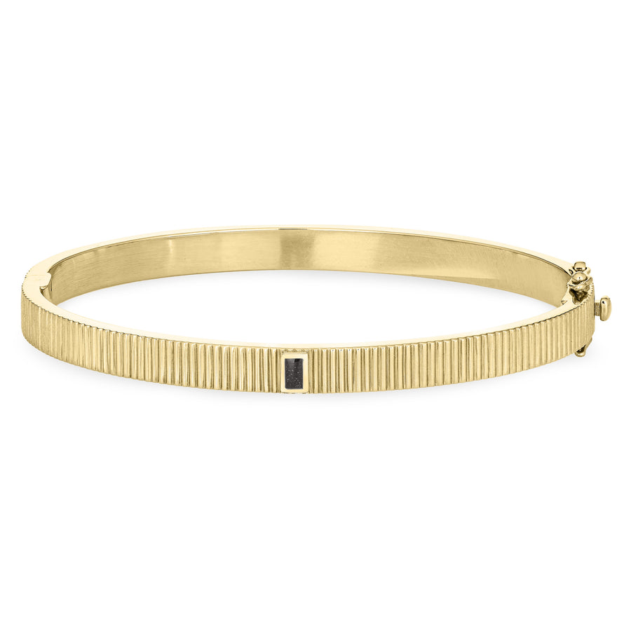 Close By Me's Tessa Bangle Cremation Bracelet in 14K Yellow Gold lays flat and facing forward in a closed position against a solid white backdrop.