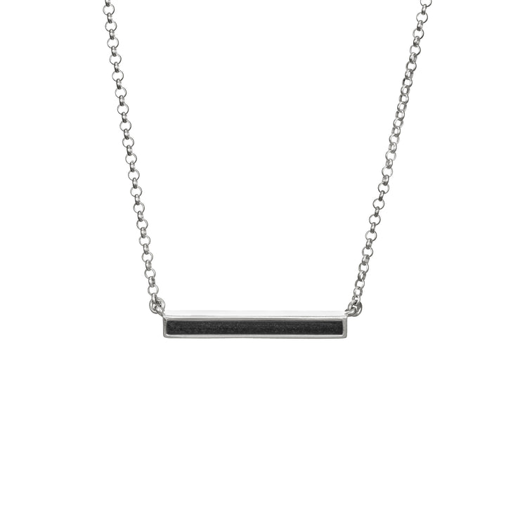 A front view of the thin lateral bar memento necklace with ashes in sterling silver by close by me jewelry