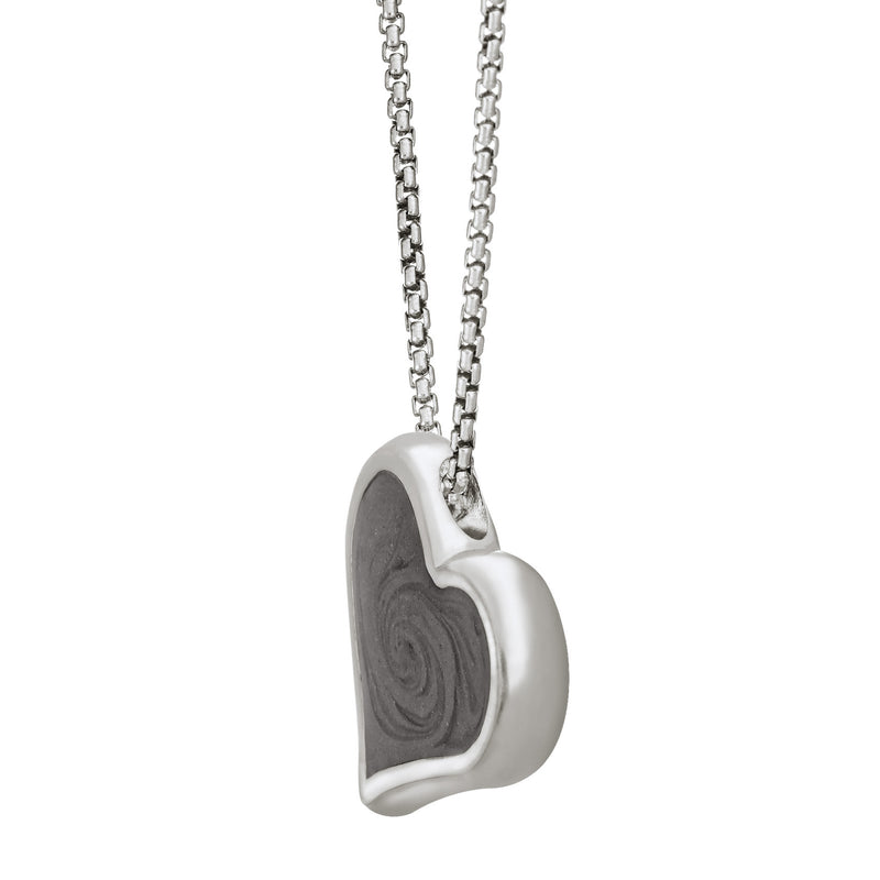 The Sterling Silver Heart Ashes Pendant, designed by close by me with a hidden bail to make the piece tilt, from the side