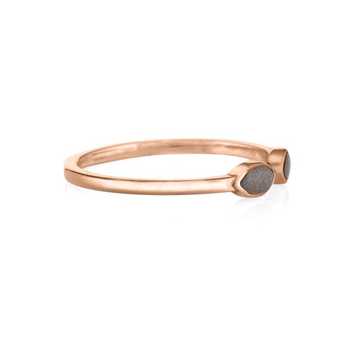 side view of close by me's 14k rose gold cremation ring with two marquise-shaped ash settings