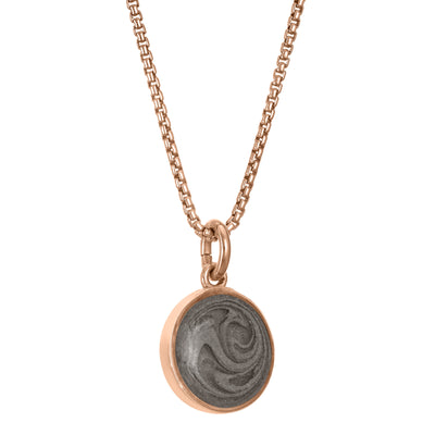 A side view of Close By Me Jewelry's 10mm Dome Cremation Necklace in 14K Rose Gold.