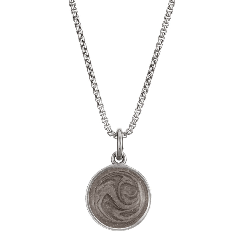 Pictured here is the 10mm Dome Pendant with ashes, designed by close by me jewelry in Sterling Silver, from the front