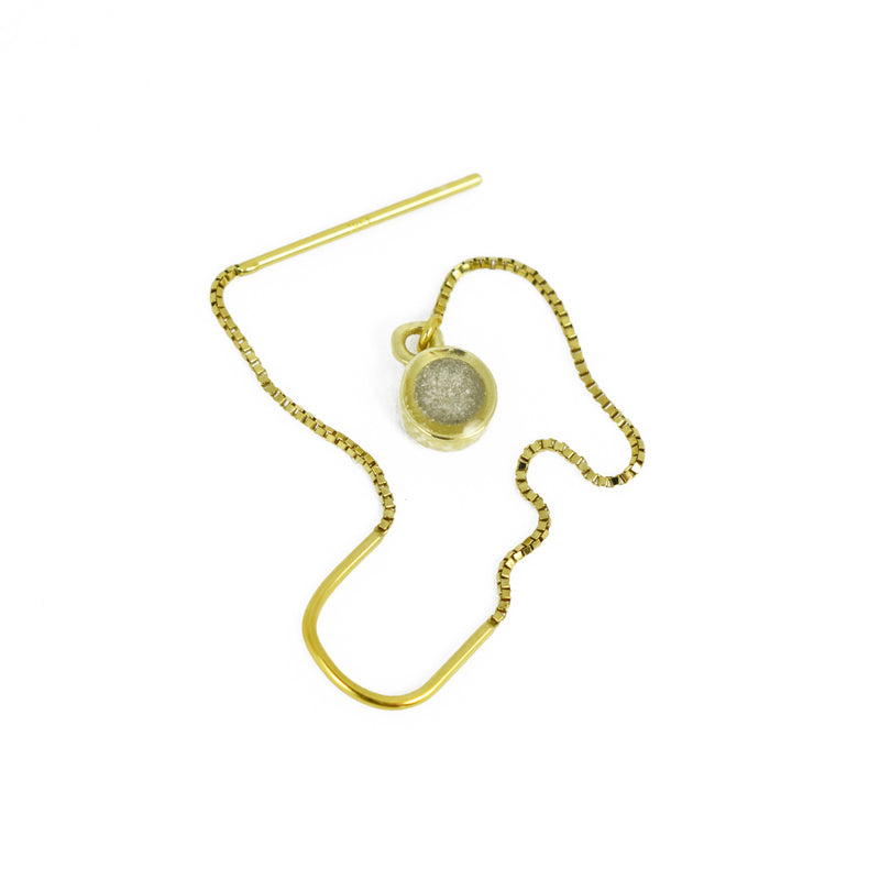 single 14k yellow gold bilateral ashes earring shown by itself with a white background