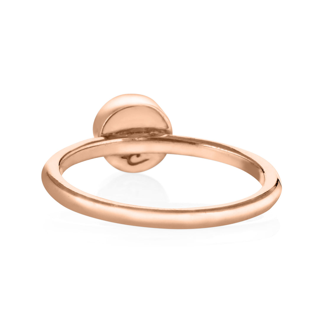 This photo shows close by me jewelry's 14K Rose Gold 5mm Circle Stacking Ring design from the back to show the inside of the band and back of the bezel