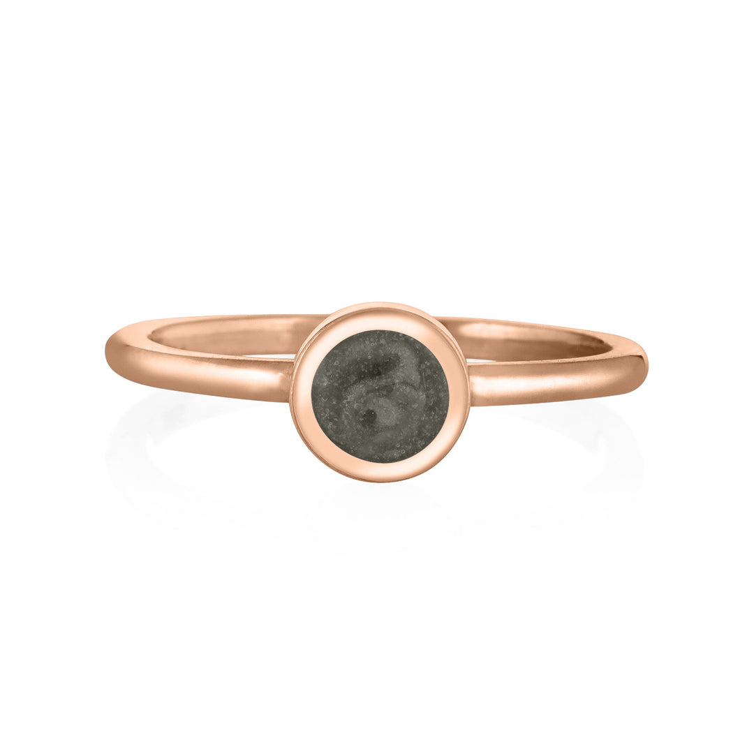 This photo shows close by me jewelry's 14K Rose Gold 5mm Circle Stacking Ring design from the front to show its grey cremation setting