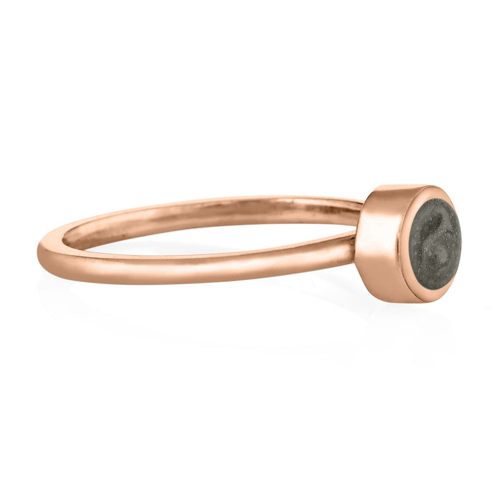 This photo shows close by me jewelry's 14K Rose Gold 5mm Circle Stacking Ring design from the side to show the thickness of the bezel and how it sits on the band