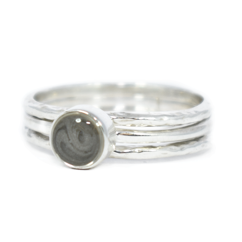 Pictured here is a Sterling Silver Cremation Ring set with a 5mm Circle Setting by close by me jewelry at a slight angle
