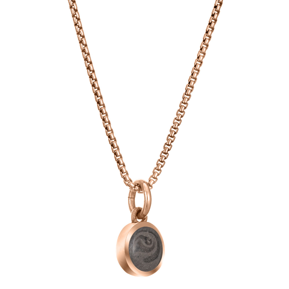 Pictured here is the 14K Rose Gold 6mm Dome Necklace with ashes designed by close by me jewelry from the side