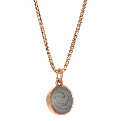 This photo shows the 8mm Dome Ashes Necklace designed and set by close by me jewelry in 14K Rose Gold from the side
