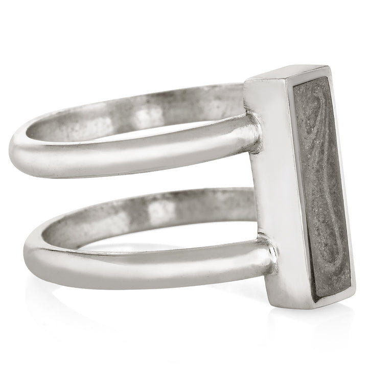 Pictured here is the Sterling Silver Bar Cremation Ring design by close by me jewelry from the side to show the band connections, thickness of the bezel and light gray cremation setting