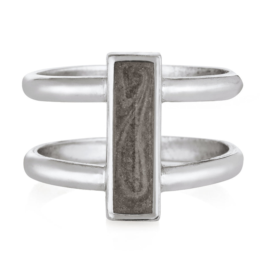 Pictured here is the 14K White Gold Bar Ashes Ring by close by me jewelry from the front to show its light grey cremation setting