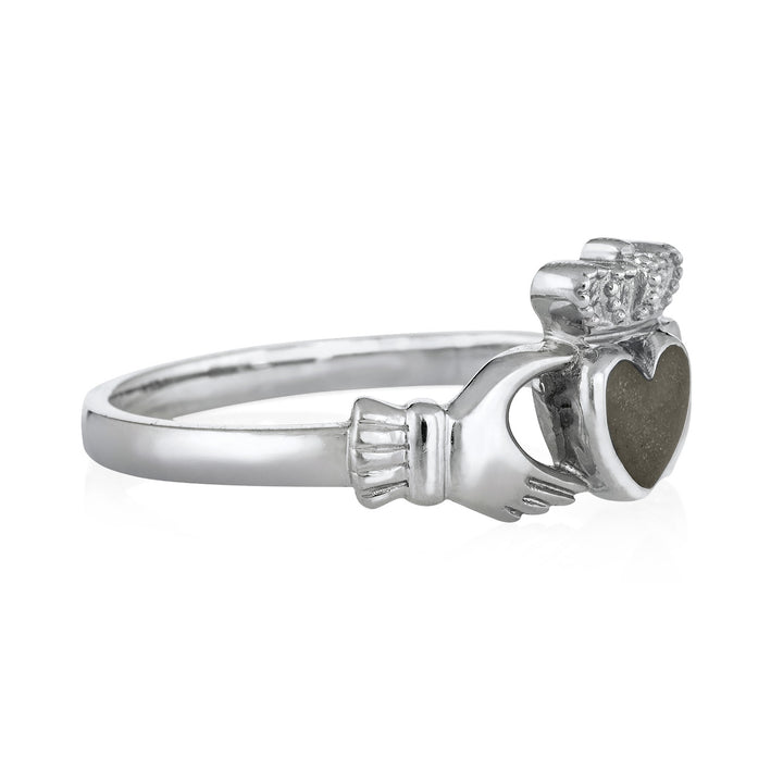 Pictured here is close by me jewelry's 14K White Gold Claddagh Ashes Ring design from the side to show the thickness of its bezel and band