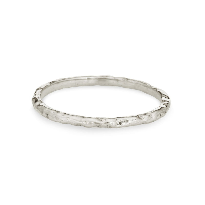 Pictured here is the Textured Companion Stacking Ring by close by me jewelry in Sterling Silver