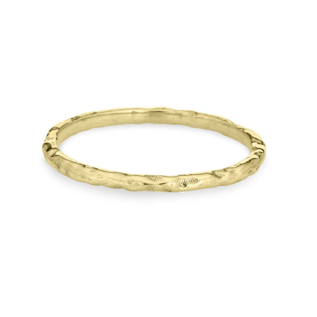 This photo shows the 14K Yellow Gold Companion Stacking Ring by close by me jewelry in a textured finish