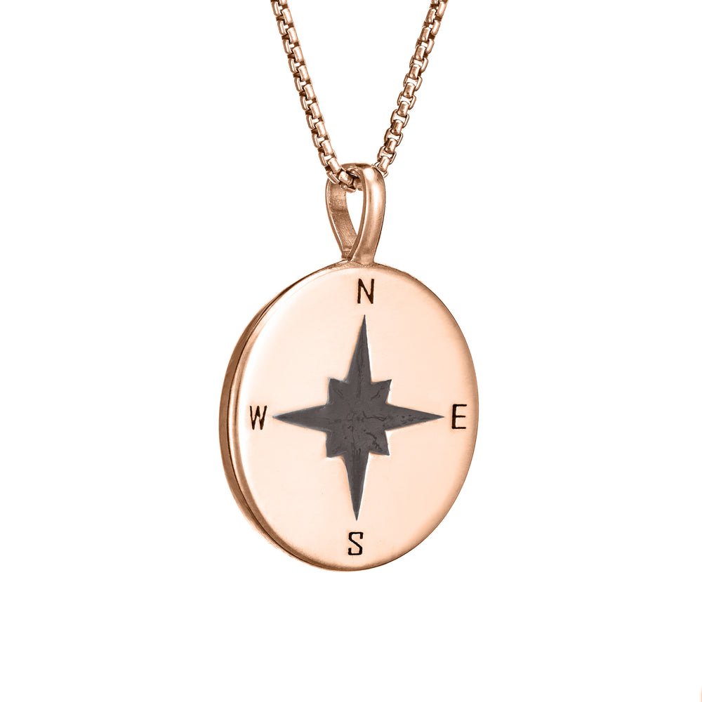 This photo shows the Compass Cremation Pendant design with a shiny finish by close by me jewelry in 14K Rose Gold from the side