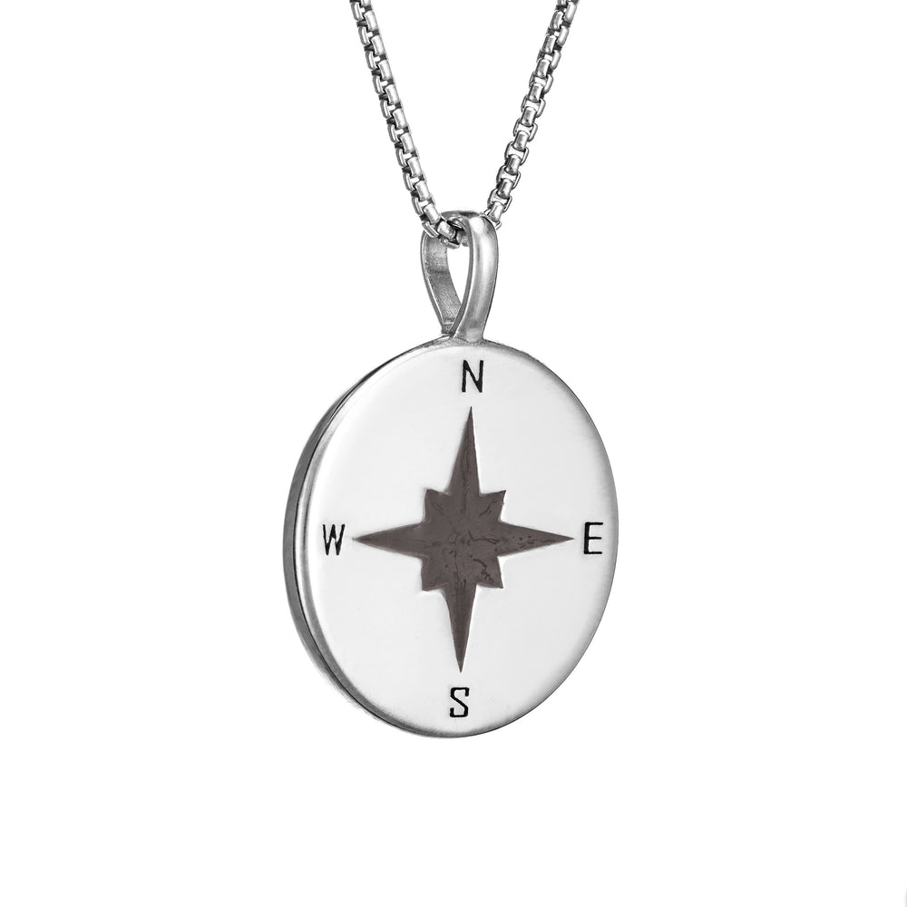 This photo shows the Compass Cremation Pendant design with a shiny finish by close by me jewelry in Sterling Silver from the side