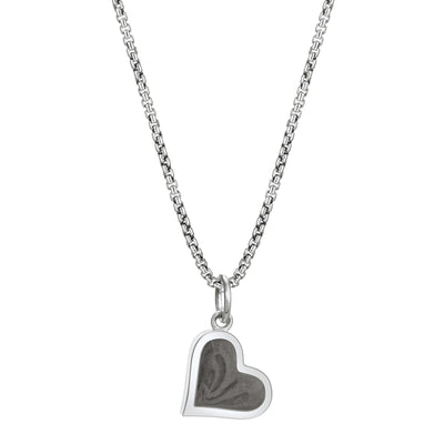 Pictured here is close by me jewelry's Sterling Silver Dainty Heart Cremains Charm on a chain from the front