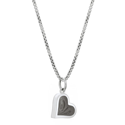 Pictured here is close by me jewelry's Sterling Silver Dainty Heart Cremains Charm on a chain from the side