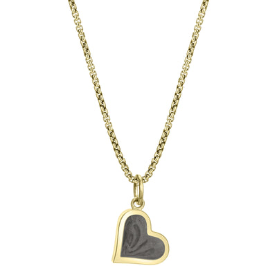 This photo shows the Dainty Heart Cremated Remains Charm designed in 14K Yellow Gold by close by me jewelry on a chain from the front