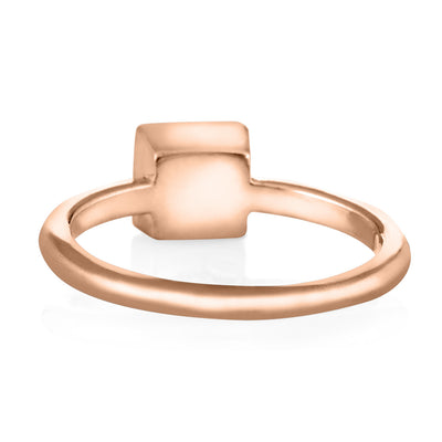 Pictured here is the Dainty Square Cremation Ring in 14K Rose Gold from the back to show the inside of the band and back of the setting
