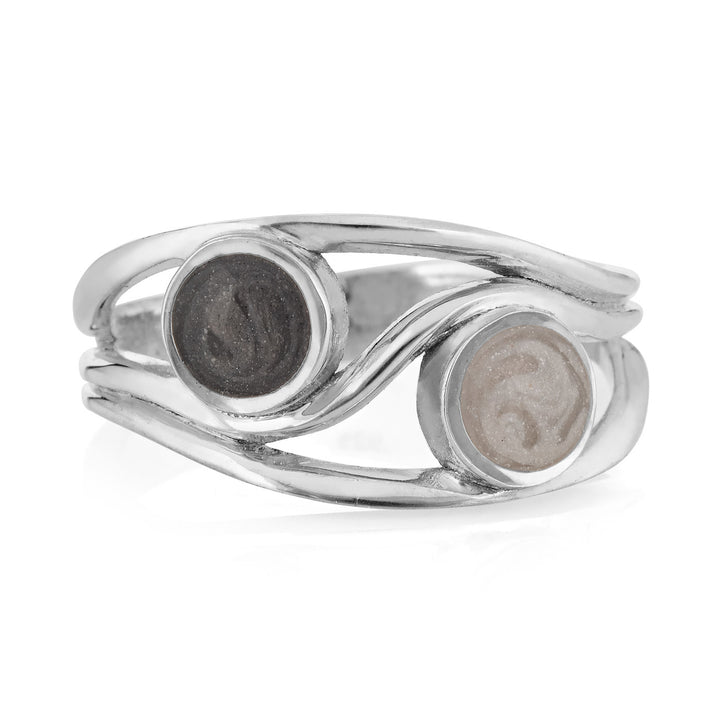 Pictured here is close by me jewelry's Sterling Silver Ashes Double Setting Ring from the front to show the two differently colored cremation settings it has