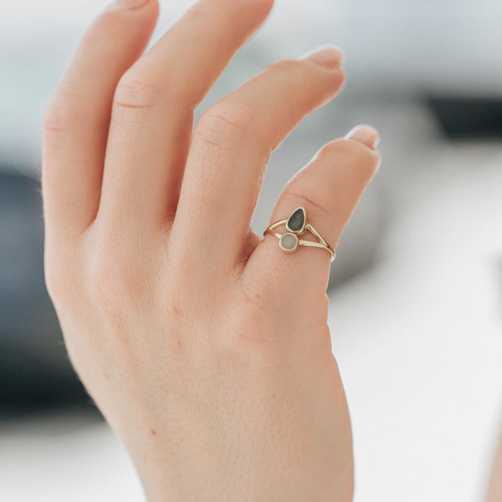 This photo shows a model holding up her hand to show the Double Setting Split Shank Cremation Ring design in 14K Yellow Gold by close by me jewelry