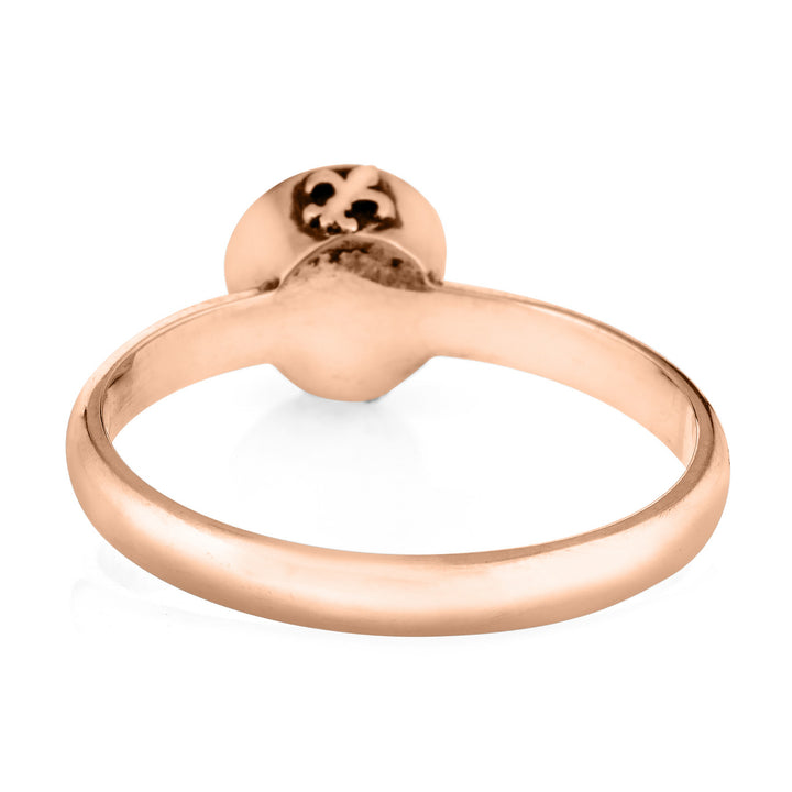 This photo shows the Fleur de Lis Cremation Ring design with ashes by close by me jewelry in 14K Rose Gold from the back