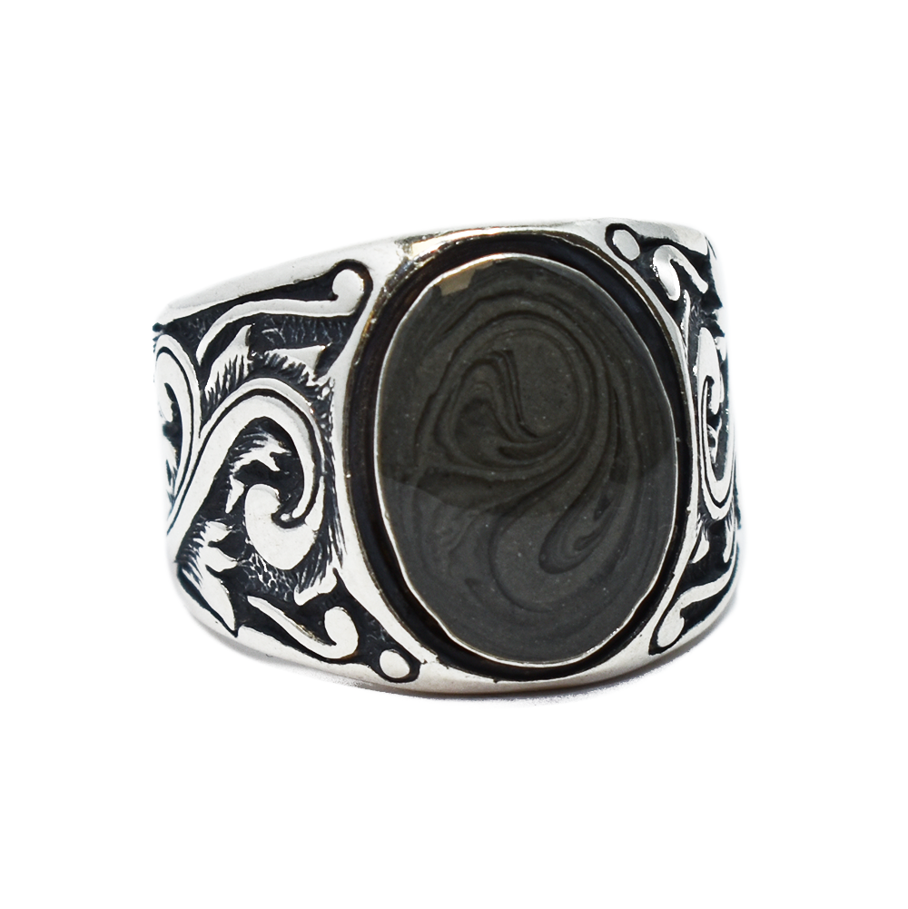 Pictured here is the close by me jewelry's Floral Art Deco Band Cremation Ring in Sterling Silver from the front and at an angle to show its dark gray ashes setting and band detail